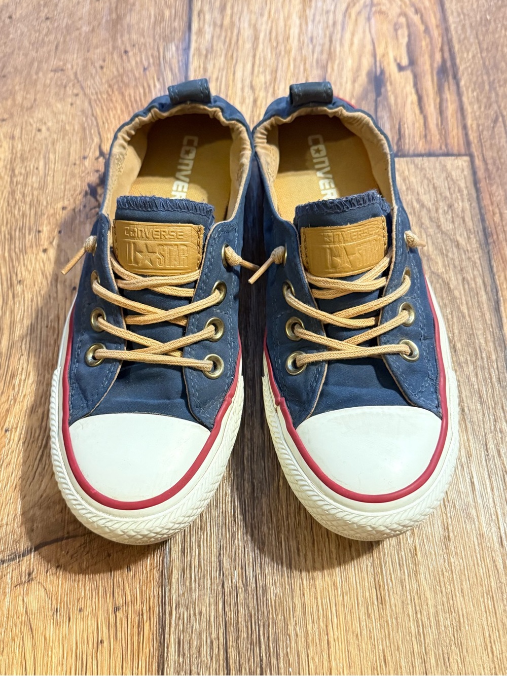 Converse Low-Top Navy Canvas Sneakers with Red Trim and Tan Details